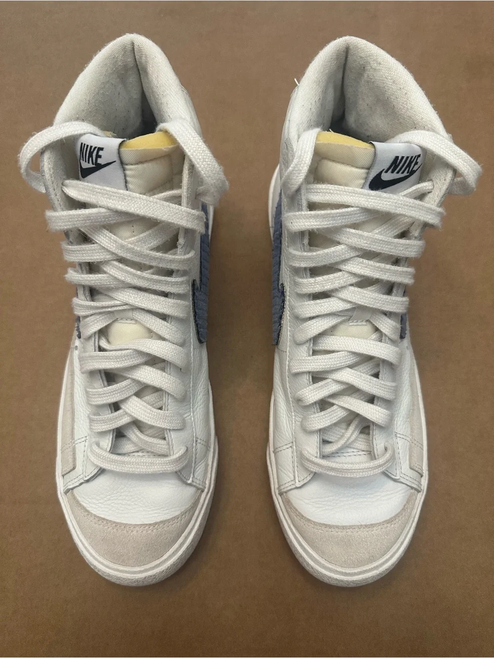 Nike White High-Top Sneakers with Blue Swoosh